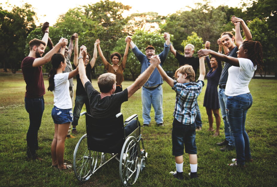Group of people celebrating whilst holding hands