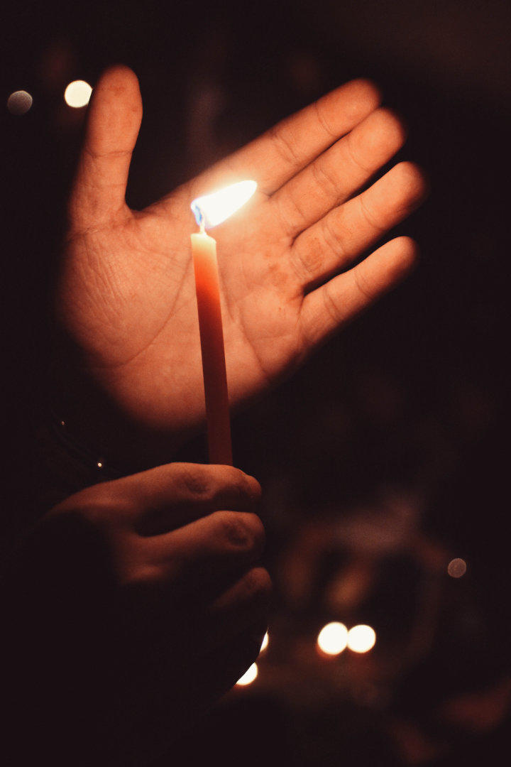 Hand near a candle