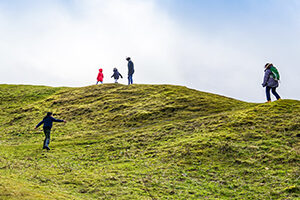 Family walking along a ridge