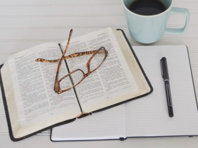 Bible, pen and glasses