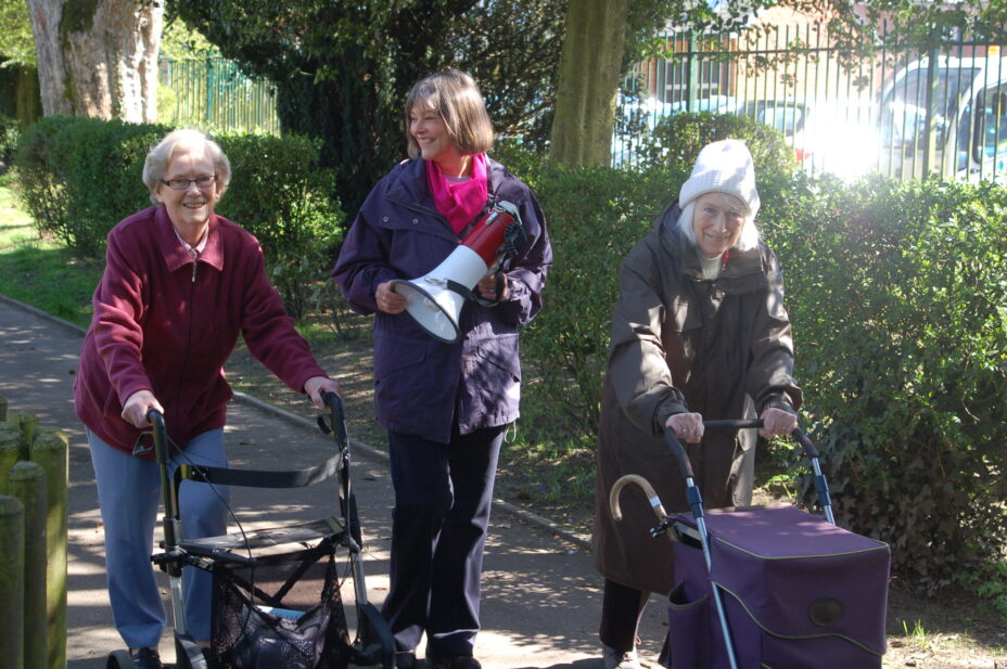 BRF's Anna Chaplaincy Pioneer with two older ladies using walking frames on an Anna Chaplaincy sponsored walk