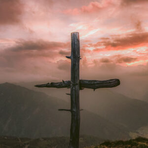 A wooden cross overlooking mountains