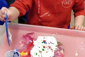 Child doing an activity in Messy Church