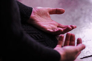 Hands open in prayer