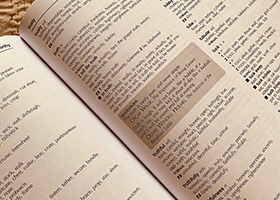 An open dictionary showing definitions of truth