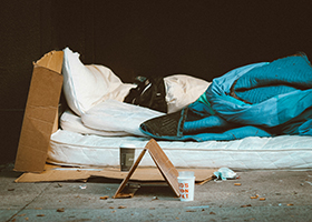 A homeless person's mattress and sleeping bag