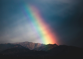 A rainbow above a mountain landscape